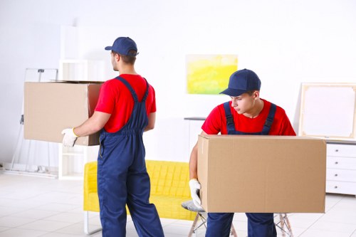 Removal team preparing a flat move in Earls Court with boxes and furniture