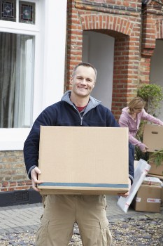 Furniture removals team planning a move in Earls Court street with parking and access challenges