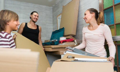 Moving team loading boxes and furniture for a UK removal service