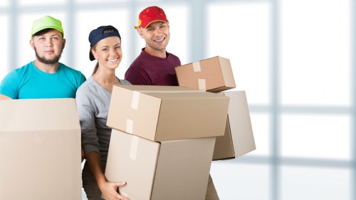 Team organising office boxes and IT equipment during an Earls Court move