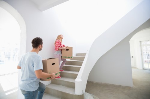 Local piano movers coordinating a careful delivery in Earls Court