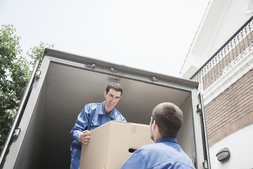 Furniture and boxes being loaded for a move in Earls Court