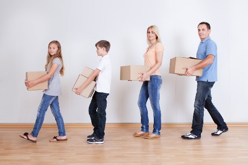 Packed boxes and furniture ready for a local flat removal in Earls Court