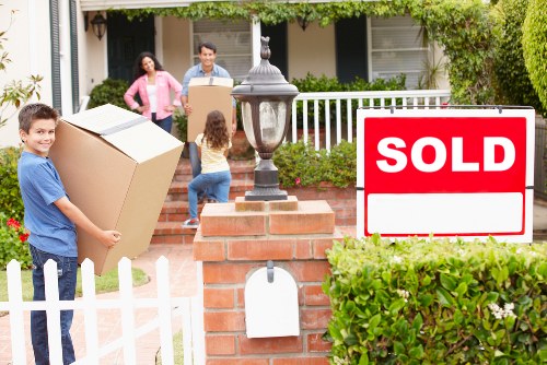 Moving boxes and furniture from an Earls Court apartment with narrow access