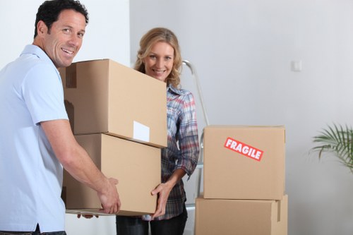 Unpacking household items in a new Earls Court property